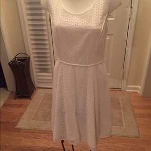 White eyelet sleeveless dress. Pretty lady