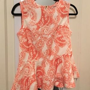 Off white peplum top with orange pattern