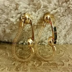 Melody Ehsani gold tone hold the phone earrings