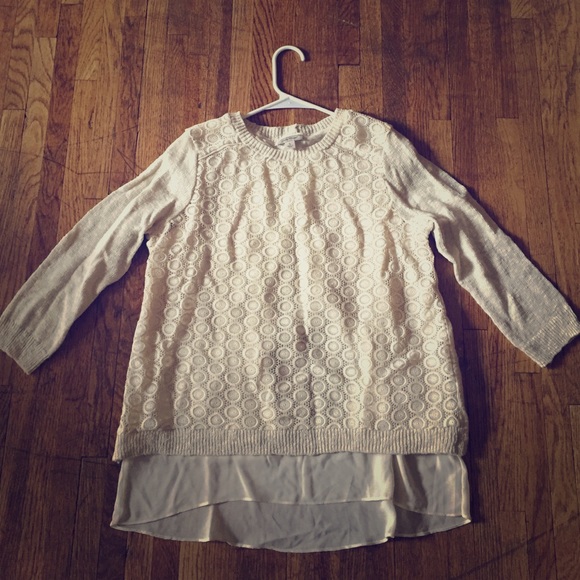 Creamy layered sweater top with sheer underlay.
