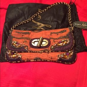 Mary Francis clutch with shoulder strap.