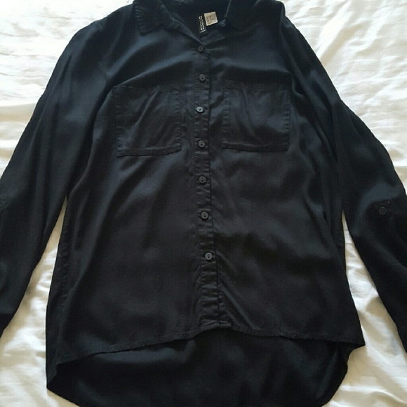 Black blouse/short in front longer in back