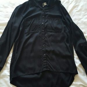 Black blouse/short in front longer in back