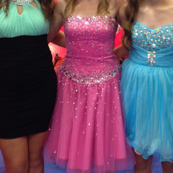Pink sparkle dress (in middle)