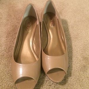 Blush patent leather flats with a small heel
