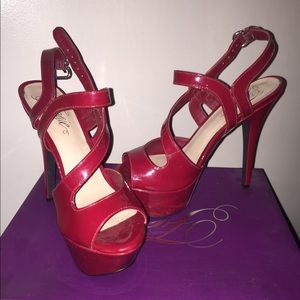Red patten leather heeled sandals.
