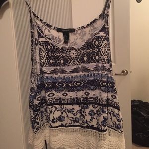 Slight crop top, multiple prints. Never worn
