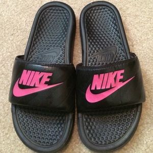 Black and pink Nike slip ons