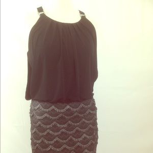 Stand out in this black and lace dress by Guess!