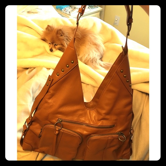 Camel colored purse with brass nail head accent