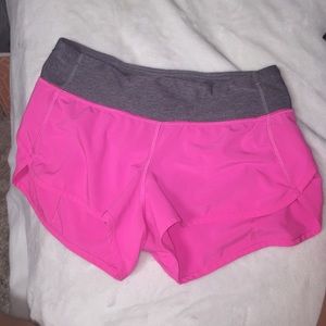 size four lulu lemon shorts. bright pink