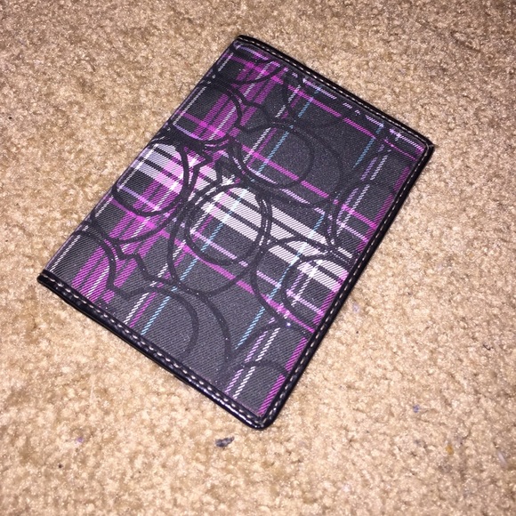 COACH passport holder.