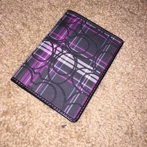 COACH passport holder.