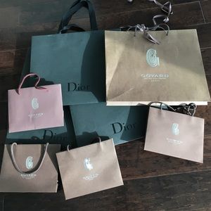 3 Dior and 5 Goyard shopping bags