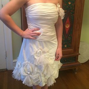 Cream dress with flower skirt and ruched bodice