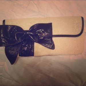 Faux lace and leather clutch