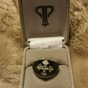 Priscilla Presley black cross ring