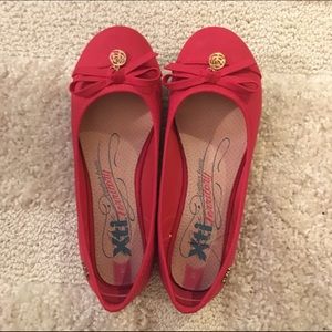 Red flats. Never worn but not with box