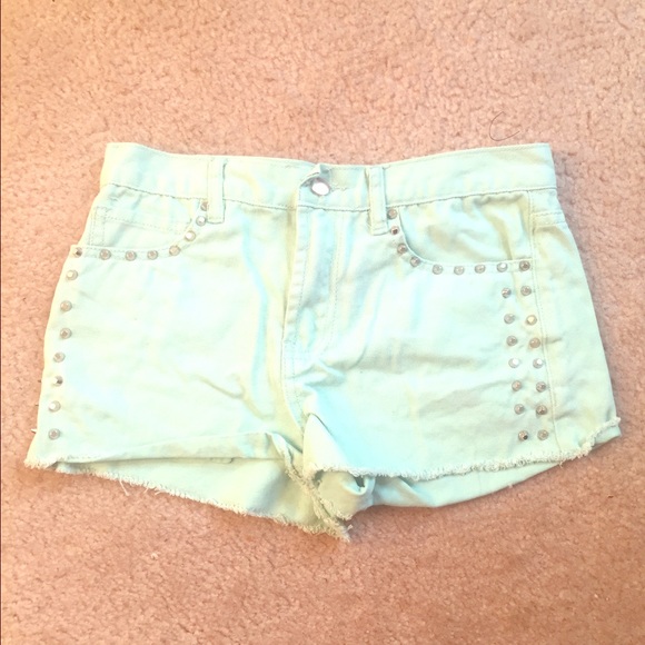 Green studded high waisted shorts