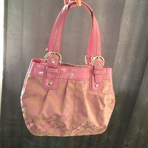 Pink signature coach purse.