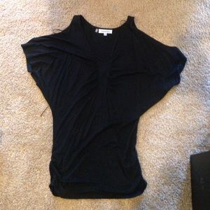 A black Jennifer Lopez shirt. Cut out on shoulder.