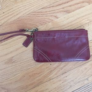 Coach dark red leather wristlet.