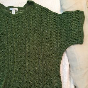 Cable knit sweater cover.