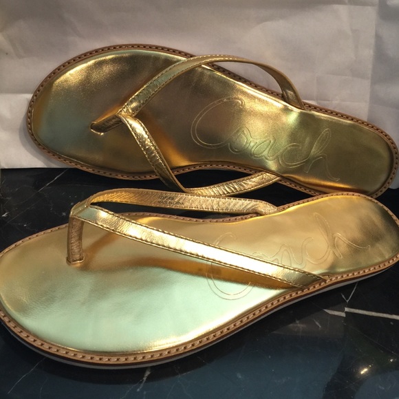 LIKE NEW gold coach flip flops