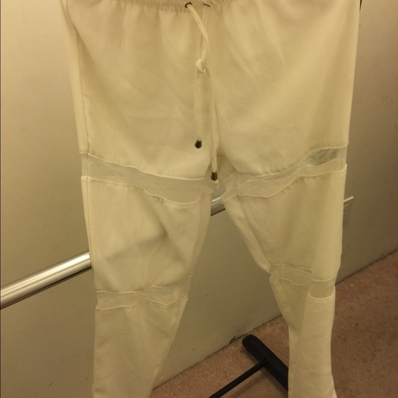 White joggers + mesh.