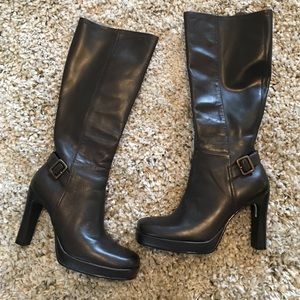 Dark brown boots with buckle accents