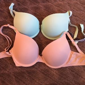 2 pink push up bras