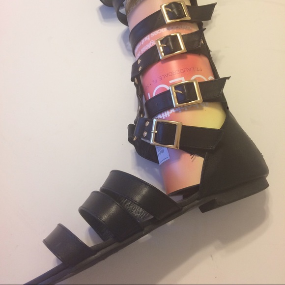Knee length gladiator sandals