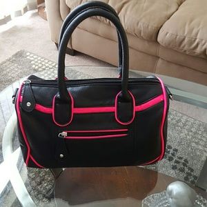 Black purse with pink accent