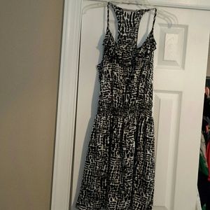T strap back ruffle front dress