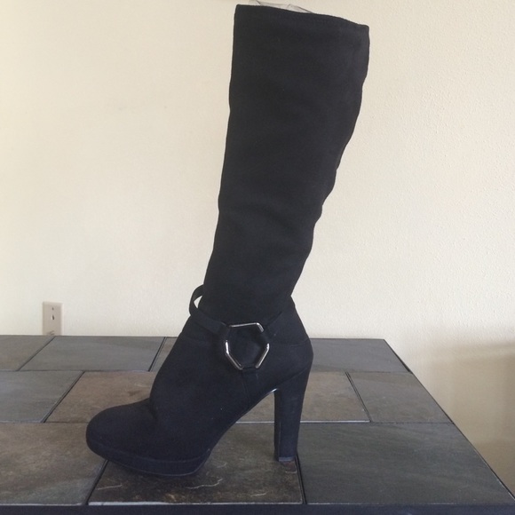 Black suede knee high boots.