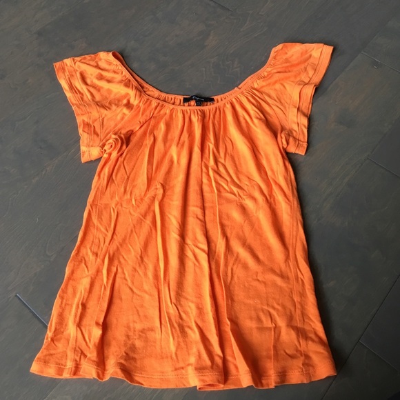 Express orange top with Ruffled shoulders