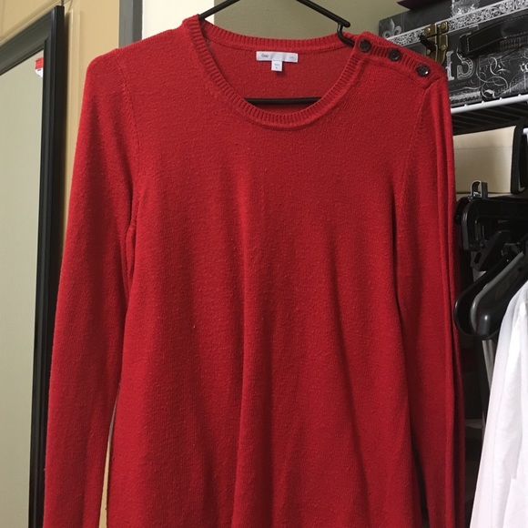 Red sweater with three buttons on shoulder