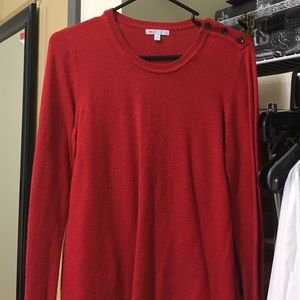 Red sweater with three buttons on shoulder