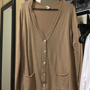 Long sweater with front pockets