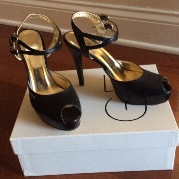 GF Ferre black double strap peep-toe sandals.
