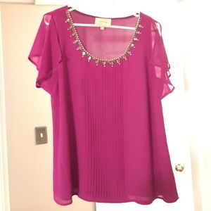 Blouse with embellished neckline