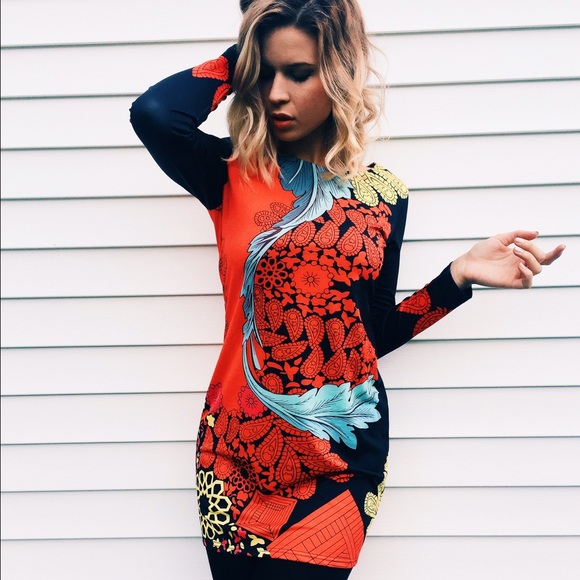 Sleeved cocktail length dress by Aryeh