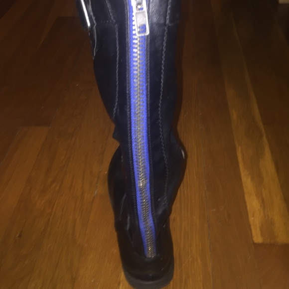 black boots with blue zipper