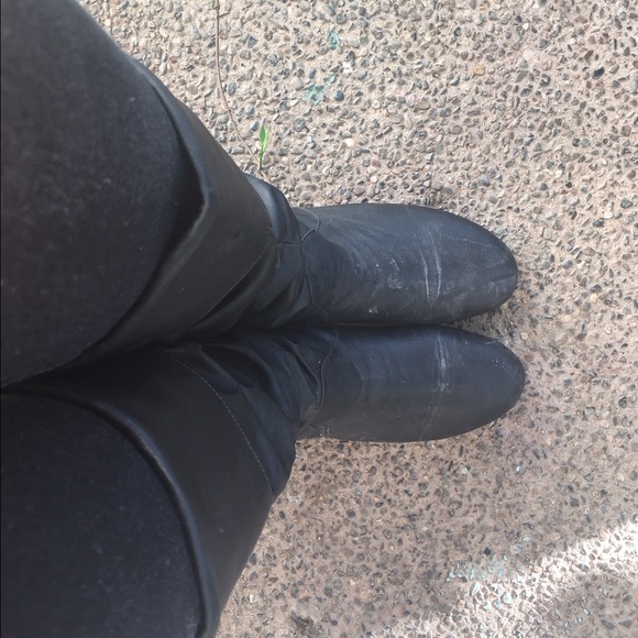 Black thigh length boots