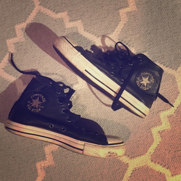 Black leather converse higher tops.