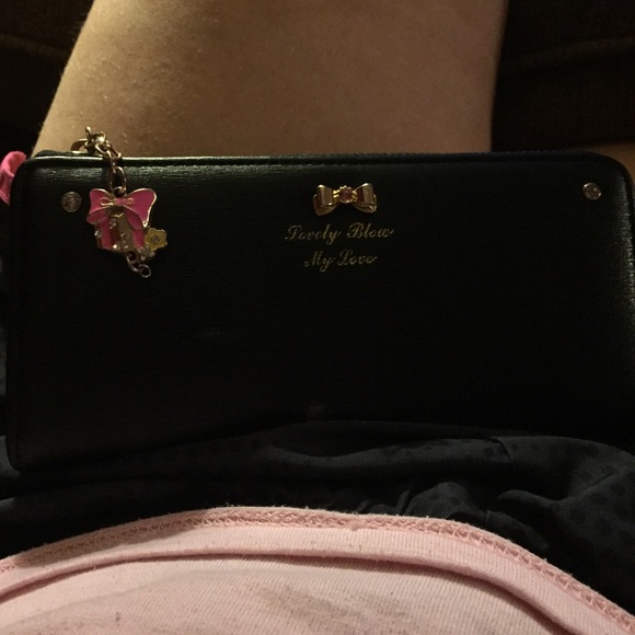 Black wallet with pink in-lining