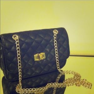 Express black purse with gold chains, satchel