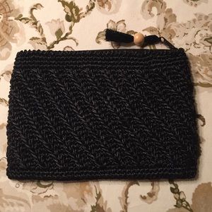 Black pouch with a zipper. New, no tags!