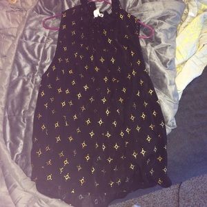 High neck sleeveless black and gold top