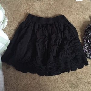A black skirt with ruffles on the bottom.